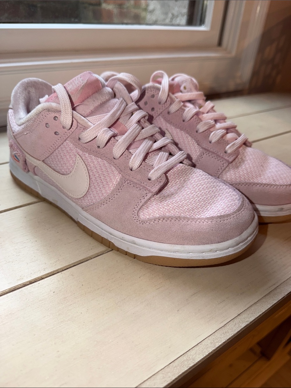 Nike Women’s Low-Top Sneakers in Light Pink with White Swoosh